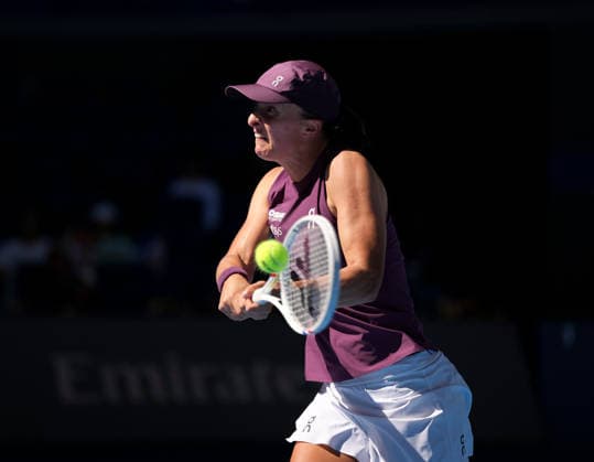 (261005) -- BEIJING, Oct. 5, 2026 -- Iga Swiatek of Poland hits a return during the women s singles round of 32 match against Donna Vekic of Croatia at 2026 China Open tennis tournament in Beijing, China, Oct. 5, 2026. ) (SP)CHINA-BEIJING-TENNIS-CHINA OPEN-WOMEN S SINGLES(CN) SunxFei 