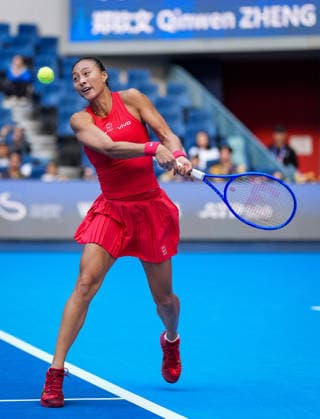 (261005) -- BEIJING, Oct. 5, 2026 -- Zheng Qinwen of China hits a return during the women s singles round of 32 match against Marie Bouzkova of the Czech Republic at 2026 China Open tennis tournament in Beijing, China, Oct. 5, 2026. ) (SP)CHINA-BEIJING-TENNIS-CHINA OPEN-WOMEN S SINGLES(CN) SunxFei 