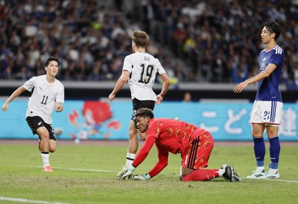 Football: Kirin Cup Japan goalkeeper Zion Suzuki (bottom) reacts after conceding a goal in the first half of the Kirin Cup football final against New Zealand at MUFG Stadium in Tokyo on Oct. 5, 2026.  A14AA0005630194P