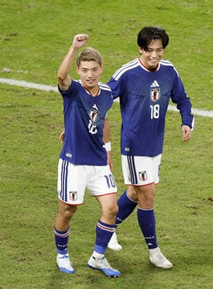 Football: Kirin Cup Japan s Ritsu Doan (L) celebrates with Ayase Ueda after scoring in the second half of the Kirin Cup football final against New Zealand at MUFG Stadium in Tokyo on Oct. 5, 2026.  A14AA0005630198P