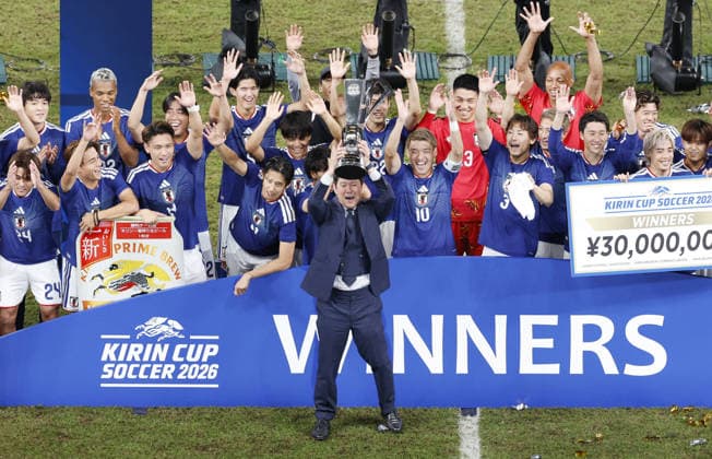 Football: Kirin Cup Japan head coach Hajime Moriyasu (C) and his players celebrate after winning the Kirin Cup football title with a 2-1 victory over New Zealand in the cup final at MUFG Stadium in Tokyo on Oct. 5, 2026.  A14AA0005630201P