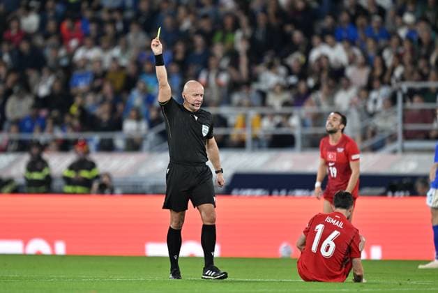 Italy v Turkiye - UEFA Nations League BOLOGNA, ITALY - OCTOBER 5: Polish referee Szymon Marciniak shows a yellow card to Ismail Yuksek (16) of Turkiye during the UEFA Nations League Group A1 match between Italy and Turkiye at Stadio Renato Dall Ara in Bologna, Italy on October 5, 2026. Mustafa Yalcin Anadolu Bologna Italy. Editorial use only. Please get in touch for any other usage.  Copyright: x2026xAnadoluxMustafaxYalcinx
