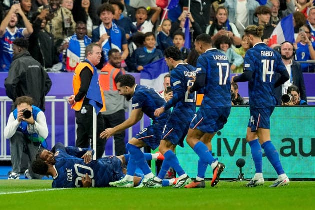 Michael Olise (France) celebrates after scoring his team s third goal with teammates during the UEFA Nations League 2026 27 group phase match between France and Belgium at Stade de France on October 5, 2026 in Paris, France. (Photo by Alex Gottschalk DeFodi Images) -