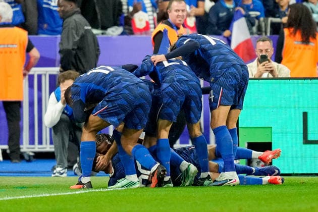 Michael Olise (France) celebrates after scoring his team s third goal with teammates during the UEFA Nations League 2026 27 group phase match between France and Belgium at Stade de France on October 5, 2026 in Paris, France. (Photo by Alex Gottschalk DeFodi Images) -