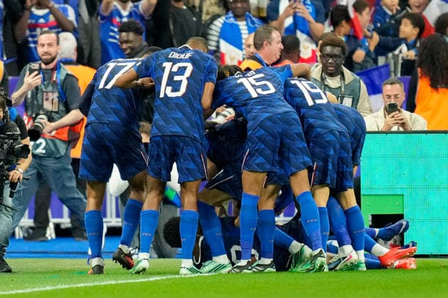 Michael Olise (France) celebrates after scoring his team s third goal with teammates during the UEFA Nations League 2026 27 group phase match between France and Belgium at Stade de France on October 5, 2026 in Paris, France. (Photo by Alex Gottschalk DeFodi Images) -