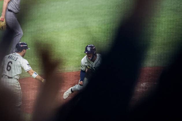 October 5, 2026, St. Petersburg, Florida, USA: Tampa Bay Rays right fielder JONNY DELUCA (21) reacts at home plate after scoring a run in game 2 of the American League Division Series against the New York Yankees. The Tampa Bay Rays hosted the New York Yankees the at Tropicana Field in St. Petersburg, FL. MLB, Baseball Herren, USA 2026: Tampa Bay Rays 5:2 New York Yankees  - ZUMAm299 20261005_znp_m299_005 Copyright: xTaylorxMcFeex