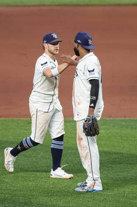October 5, 2026, St. Petersburg, Florida, USA: Tampa Bay Rays shortstop TAYLOR WALLS (6) and third baseman JUNIOR CAMINERO (13) celebrate after a win against the New York Yankees in game 2 of the American League Division Series. The Tampa Bay Rays hosted the New York Yankees the at Tropicana Field in St. Petersburg, FL. St. Petersburg USA - ZUMAm299 20261005_znp_m299_030 Copyright: xTaylorxMcFeex