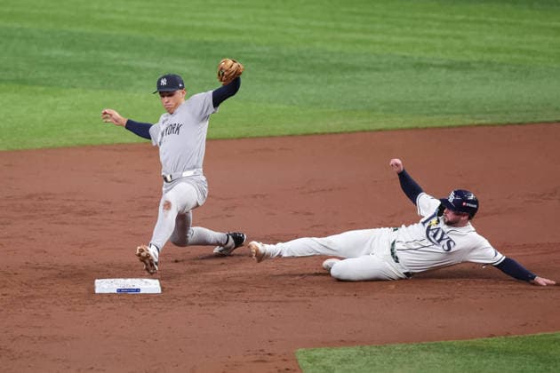 October 5, 2026, St. Petersburg, Florida, USA: New York Yankees shortstop GEORGE LOMBARD JR. (96) reaches towards second base for a double play during game 2 of the American League Division Series against the Tampa Bay Rays. The Tampa Bay Rays hosted the New York Yankees the at Tropicana Field in St. Petersburg, FL. MLB, Baseball Herren, USA 2026: Tampa Bay Rays 5:2 New York Yankees  - ZUMAm299 20261005_znp_m299_047 Copyright: xTaylorxMcFeex