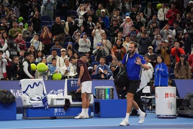 (261006) -- BEIJING, Oct. 6, 2026 -- Daniil Medvedev (R) leaves the court after the men s singles semifinal match between Daniil Medvedev of Russia and Novak Djokovic of Serbia at 2026 China Open tennis tournament in Beijing, China, Oct. 5, 2026. ) (SP)CHINA-BEIJING-TENNIS-CHINA OPEN-MEN S SINGLES(CN) XiexHan 