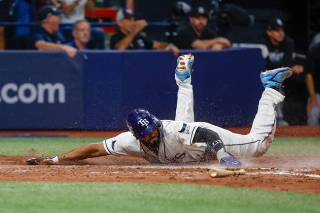 October 5, 2026, St. Petersburg, Florida, USA: Tampa Bay Rays third baseman Junior Caminero (13) slides into home plate and scores against the New York Yankees during the fifth inning at Tropicana Field on Monday, Oct. 5, 2026, in St. Petersburg. Florida News - October 5, 2026  - ZUMAs70_ 0868675365st Copyright: xJeffereexWoox