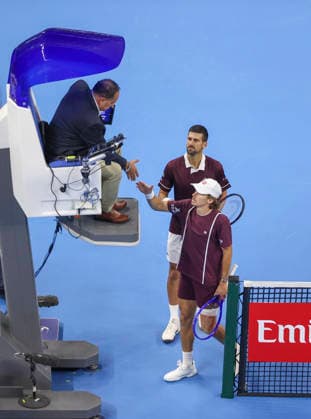 (261006) -- BEIJING, Oct. 6, 2026 -- Alex de Minaur (R) of Australia shakes hands with the umpire after the men s singles final match against Novak Djokovic (C) of Serbia at 2026 China Open tennis tournament in Beijing, China, Oct. 6, 2026. (Photo by Xinhua) (SP)CHINA-BEIJING-TENNIS-CHINA OPEN-MEN S SINGLES-FINAL(CN) MaxZihan 