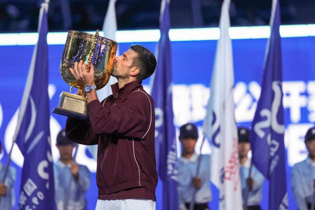 (261006) -- BEIJING, Oct. 6, 2026 -- Winner Novak Djokovic of Serbia kisses the trophy during the awarding ceremony for the men s singles final at 2026 China Open tennis tournament in Beijing, China, Oct. 6, 2026. ) (SP)CHINA-BEIJING-TENNIS-CHINA OPEN-MEN S SINGLES-AWARDING CEREMONY(CN) BaixXuefei 