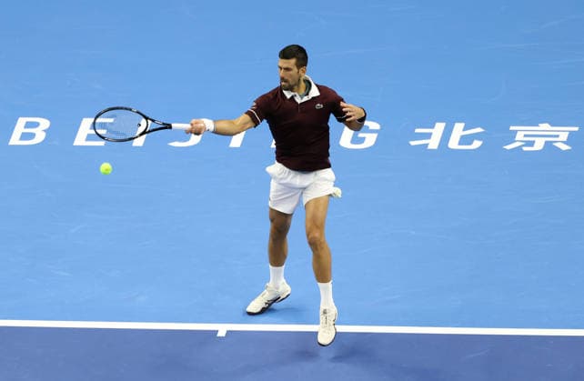 (261006) -- BEIJING, Oct. 6, 2026 -- Novak Djokovic of Serbia hits a return during the men s singles final against Alex de Minaur of Australia at 2026 China Open tennis tournament in Beijing, China, Oct. 6, 2026. ) (SP)CHINA-BEIJING-TENNIS-CHINA OPEN-MEN S SINGLES-FINAL(CN) ZhangxChenlin 