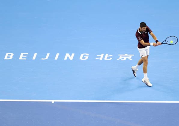 (261006) -- BEIJING, Oct. 6, 2026 -- Novak Djokovic of Serbia hits a return during the men s singles final against Alex de Minaur of Australia at 2026 China Open tennis tournament in Beijing, China, Oct. 6, 2026. ) (SP)CHINA-BEIJING-TENNIS-CHINA OPEN-MEN S SINGLES-FINAL(CN) ZhangxChenlin 