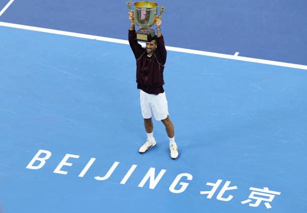 (261006) -- BEIJING, Oct. 6, 2026 -- Winner Novak Djokovic of Serbia holds up the champion trophy during the awarding ceremony for the men s singles final at 2026 China Open tennis tournament in Beijing, China, Oct. 6, 2026. ) (SP)CHINA-BEIJING-TENNIS-CHINA OPEN-MEN S SINGLES-AWARDING CEREMONY(CN) ZhangxChenlin 
