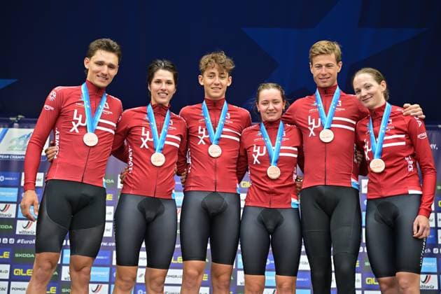 Third placed Team Luxembourg celebrates on the podium of the time trial mixed relay elite race (44,2 km) at the cycling UEC Road European Championships, in Ljubljana, Slovenia Tuesday 6 October 2026. The UEC Road European Championships are taking place from 02 to 07 October in Ljubljana, Slovenia. DAVIDxPINTENS  x188937496x