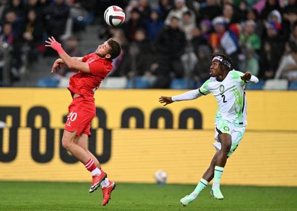 Russia Soccer Friendly Russia - Nigeria 9258733 06.10.2026 Russia s Lechi Sadulaev and Nigeria s Abdullahi Bewene struggle for the ball in the air during the friendly soccer match between Russia and Nigeria at Sovcombank Arena in Nizhny Novgorod, Russia. Maksim Blinov Sputnik Nizhny Novgorod Russia  Copyright: xMaksimxBlinovx