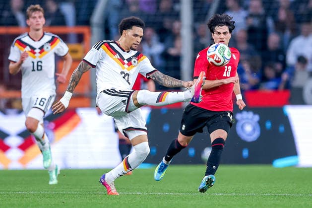 06.10.2026, Fußball, U21, U 21 Länderspiel, Deutschland - Georgien, Qualifikation U21-EM 2027, Almstadion (Bielefeld): Nnamdi Collins (U21 GER 20) im Zweikampf gegen Halid Doltmourziev (U21 Georgien 13) DFB regulations prohibit any use of photographs as image sequences and or quasi-video. Nordrhein-Westfalen Deutschland