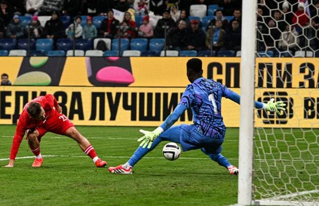 Russia Soccer Friendly Russia - Nigeria 9258749 06.10.2026 Russia s Ivan Oblyakov attempts to score as Nigeria s goalkeeper Samuel James defends his goal during the friendly soccer match between Russia and Nigeria at Sovcombank Arena in Nizhny Novgorod, Russia. Maksim Blinov Sputnik Nizhny Novgorod Russia  Copyright: xMaksimxBlinovx