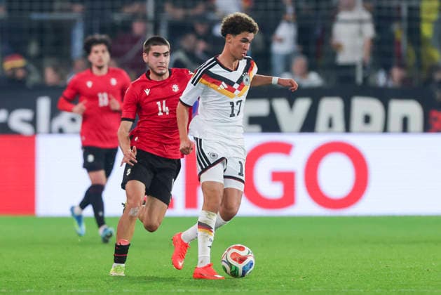 Aleko Basiladze (Georgia) und Noah Darvich (Germany) battle for the ball during the UEFA Under21 EURO Qualifier, EM, Europameisterschaft between Germany U21, U 21 and Georgia U21 at Almstadion on October 6, 2026 in Bielefeld, Germany. (Photo by Marco Steinbrenner DeFodi Images) -