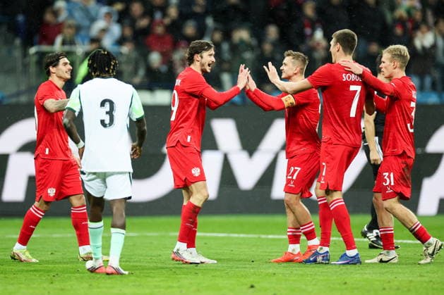 RUSSIA, NIZHNY NOVGOROD - OCTOBER 6, 2026: Russian players celebrate a goal in a football friendly match Russia vs Nigeria at Nizhny Novgorod Stadium (Sovcombank Arena). Sergei Savostyanov TASS  98878916