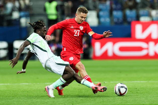 RUSSIA, NIZHNY NOVGOROD - OCTOBER 6, 2026: Nigeria s Isaac James (L) and Russia s Ivan Oblyakov in a football friendly match Russia vs Nigeria at Nizhny Novgorod Stadium (Sovcombank Arena). Sergei Savostyanov TASS  98876356