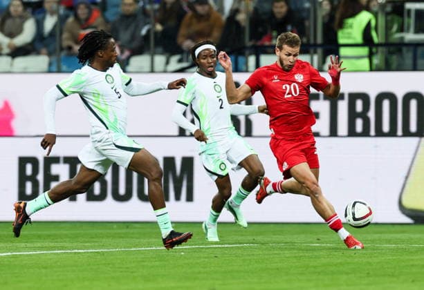 RUSSIA, NIZHNY NOVGOROD - OCTOBER 6, 2026: Nigeria s Benjamin Fredrick, Abdullahi Bewene and Russia s Lechi Sadulayev (L-R) in a football friendly match Russia vs Nigeria at Nizhny Novgorod Stadium (Sovcombank Arena). Sergei Savostyanov TASS  98876525