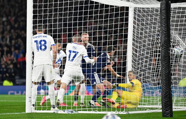 Glasgow, Scotland, 6th October 2026. Ryan Christie of Scotland scores the opening goal during the Scotland vs Slovenia UEFA Nations League match at Hampden Park, Glasgow. Picture credit should read: Neil Hanna Sportimage EDITORIAL USE ONLY. No use with unauthorised audio, video, data, fixture lists, club league logos or live services. Online in-match use limited to 120 images, no video emulation. No use in betting, games or single club league player publications. SPI_019_NH_Scotland_Slovenia SPI-5054-0019