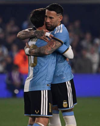 BUENOS AIRES, ARGENTINA - OCTOBER 06 : Forward Lionel Messi 10 of Argentina national team, Nationalteam high-fives teammate Nicolas Otamendi during an International Friendly, Länderspiel, Nationalmannschaft match against Benin at Estadio Monumental on October 06, 2026 in Buenos Aires, Argentina. This historic match marks the final international appearance who wore a commemorative special-edition kit replacing the traditional manufacturer branding with his personal signature logo. Photo by SFSI Argentina National team v Benin Copyright: xSFSIx