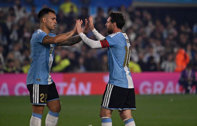 BUENOS AIRES, ARGENTINA - OCTOBER 06 : Lionel Messi of Argentina national team, Nationalteam high-fives teammate Lautaro Martinez during an International Friendly, Länderspiel, Nationalmannschaft match against Benin at Estadio Monumental on October 06, 2026 in Buenos Aires, Argentina. This historic match marks the final international appearance who wore a commemorative special-edition kit replacing the traditional manufacturer branding with his personal signature logo. Photo by SFSI Argentina National team v Benin Copyright: xSFSIx