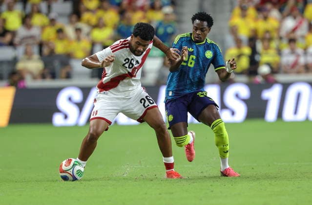 International soccer friendly - Colombia vs. Peru Peru midfielder Piero Magallanes (L) in action against Colombia forward Carlos Andres Gomez (R) during the international soccer friendly between Colombia and Peru at Nu Stadium in Miami, Florida, USA, 06 October 2026. MIAMI FLORIDA United States  Copyright: xCRISTOBALxHERRERA-ULASHKEVICHx