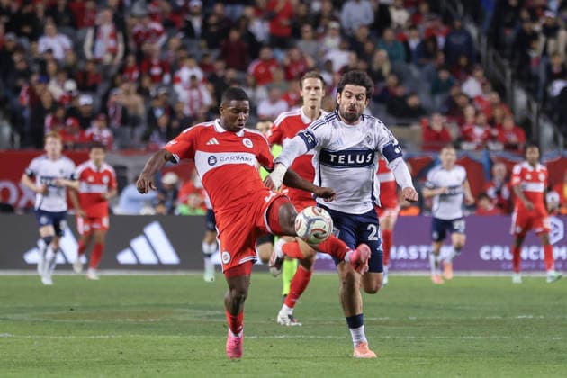 CHICAGO, USA - October 6: Mbekezeli Mbokazi (4 Chicago Fire FC) and Brian White (24 Vancouver Whitecaps FC) battle for the ball during the Major League Soccer game between Chicago Fire FC and Vancouver Whitecaps FC at Soldier Field on Tuesday October 6 in Chicago, USA Copyright: xShainaxBenhiyoun SPPx Sportspressphoto_SPR247959