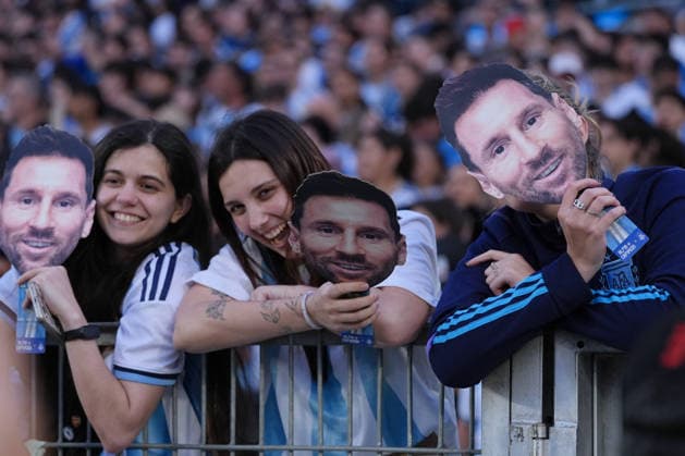 Messi bade farewell to Argentina in the friendly match against Benin BUENOS AIRES, ARGENTINA - OCTOBER 6: Argentina fans holding Messi masks show their support as Argentine football legend and national team, Nationalteam captain Lionel Messi goodbye to the crowd during his farewell match in front of over 80,000 spectators at the Monumental Stadium, in Buenos Aires, Argentina on October 6, 2026. Argentine football star Lionel Messi played his final international match, Länderspiel, Nationalmannschaft in the friendly game between Argentina and Benin. The 39-year-old walk onto the stadium pitch for the final time in the sky-blue and white jersey, entering his farewell as Argentina s record appearance-maker and leading scorer with 207 caps and 125 goals. Luciano Gonzalez Anadolu Buenos Aires Argentina. Editorial use only. Please get in touch for any other usage.  Copyright: x2026xAnadoluxLucianoxGonzalezx