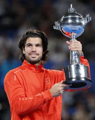 Tennis: Japan Open Carlos Alcaraz of Spain poses with the victor s trophy after winning the men s singles title at the Japan Open tennis tournament at Ariake Tennis Forest Park in Tokyo on Oct. 6, 2026.  A14AA0005630268P