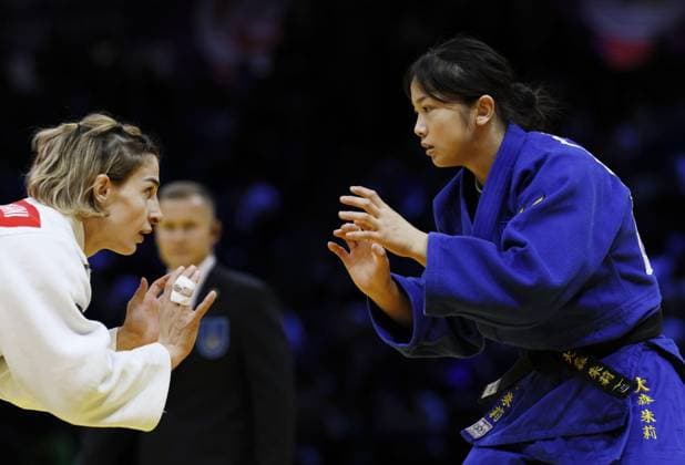 Judo: World championships Akari Omori (blue) of Japan competes en route to beating Eteri Liparteliani of Georgia in the women s 57-kilogram final at the judo world championships in Baku, Azerbaijan, on Oct. 6, 2026.  A14AA0005630285P