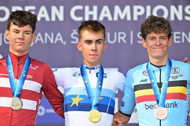 Denmark s Malthe Risbjerg; Spain s Benjamin Noval Suarez and Belgium s Vic De Smet celebrate on the podium of the Men Junior Individual Time Trial race (22km) at the cycling UEC Road European Championships, in Ljubljana, Slovenia, on Wednesday 7 October 2026. The UEC Road European Championships are taking place from 02 to 07 October in Ljubljana, Slovenia. DAVIDxPINTENS  x189038051x