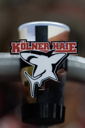 COLOGNE, GERMANY - 7 OCTOBER 2026: Image shows cup holder with Kölner Haie logo during Champions Hockey League 2026 27 League Phase, Matchday 5: Kölner Haie vs Herning Blue Fox at LANXESS arena on 7 10 2026 in Cologne, Germany. Germany Copyright: xFröhlichxPascalx