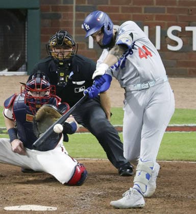 Baseball: Division Series between Dodgers and Braves Los Angeles Dodgers outfielder Andy Pages hits an RBI single in the seventh inning of Game 4 of the National League Division Series against the Atlanta Braves at Truist Park in Atlanta on Oct. 7, 2026.  A14AA0005630449P