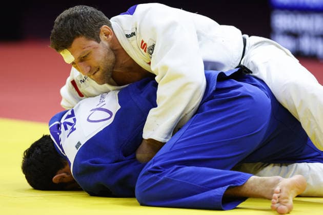 AZERBAIJAN, BAKU - OCTOBER 8, 2026: Murad Fatiyev (bottom) of Azerbaijan and Nemanja Majdov of Serbia compete in their -90 kg bout as part of the 2026 World Judo Championships at the National Gymnastics Arena. Mikhail Sinitsyn TASS  98958124