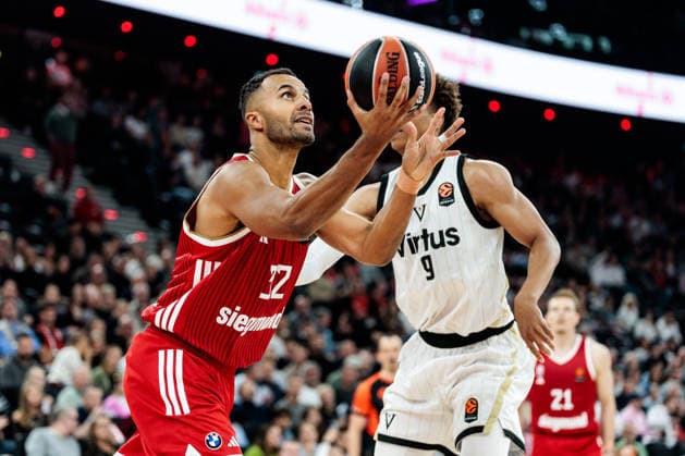 MUNICH, GERMANY - OCTOBER 08: Johannes JT Thiemann (FC Bayern Muenchen, 32) controls the ball against Kessler Edwards (Virtus Bologna, 9) during the Turkish Airlines EuroLeague match between FC Bayern Muenchen vs. Virtus Bologna at SAP Garden on round 4 of Turkish Airlines EuroLeague on October 08, 2026 in Munich, Germany. Bavaria Germany Copyright: xSteffiexWunderlx