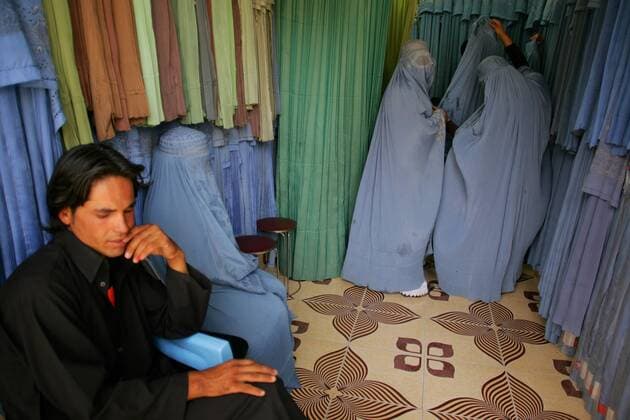 Afghan burqa-clad women shop at a store in Herat, Afghanistan on August 12, 2009. Afghanistan s presidential election will be held on August 20. UPI Mohammad Kheirkhah Daily Life in Afghanistan  AFG20090812104