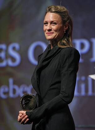 Actress Robin Wright Penn holds an award given to her during a ceremony held in her honor before a screening of the film The Private Lives of Pippa Lee at the 35th American Film Festival of Deauville in Deauville, France on September 10, 2009. UPI David Silpa Robin Wright Penn arrives at the 35th Annual American Film Festival in Deauville  DEA20090910833