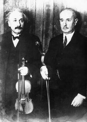 Oct 12, 1947; Berlin, Germany; Professor ALBERT EINSTEIN and LOUIS LEWANDOWSKY playing the violen for a Judaism classical concert. Albert Einstein aka Yousuf Karsh Albert Einstein (March 14, 1879 Ð April 18, 1955) was a German theoretical physicist regarded as the greatest scientist of the 20th century. He proposed the theory of relativity and made contributions to the development of quantum mechanics, statistical mechanics, and cosmology. He was awarded the 1921 Nobel Prize for Physics for his explanation of the photoelectric effect and for his services to Theoretical Physics. After his general theory of relativity was formulated in 1915. Berlin Germany  - ZUMAk09