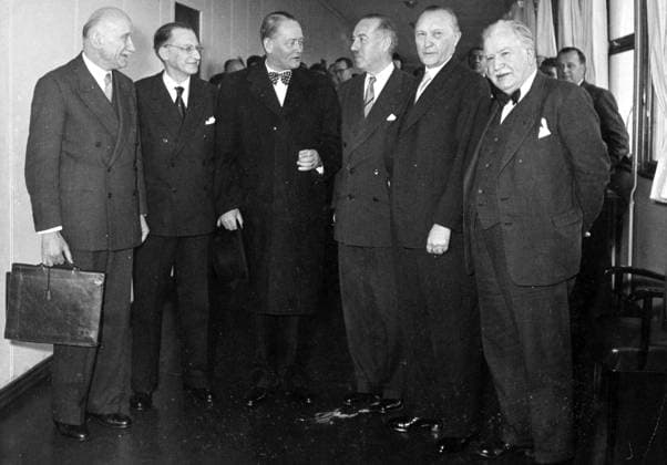 Jan 01, 1955 - Bonn, Germany - West Germany s first chancellor KONRAD ADENAUER began his career in politics as a member of the Cologne City Council, becoming lord mayor of the city. After the Nazis came to power in 1933, Adenauer, who had not hidden distaste for them, lost his positions, was forced to go into exile for a year in an abbey and was later interned in a prison camp. Adenauer was elected Chancellor of the Federal Republic of Germany on 15 September 1949. His main aim was to ensure West Germany s transition to a sovereign, democratic state. He held power for the next fourteen years and during that time played an important role in restoring good relations with France and the United States. PICTURED: Meeting of 6 Secretaries of State: ROBERT SCHUMAN (France), ALCIDE DE GASPARI (Italy), STKKER (Netherlands), VAN ZEELAND (Belgium), KONRAD ADENAUER (Germany) and JOSEPH BECH (Luxem  - ZUMAk09
