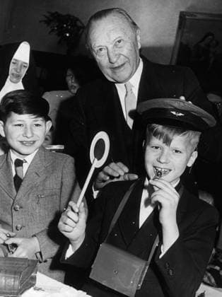 Dec 24, 1957 - Bonn, Germany - West Germany s first chancellor KONRAD ADENAUER began his career in politics as a member of the Cologne City Council, becoming lord mayor of the city. After the Nazis came to power in 1933, Adenauer, who had not hidden distaste for them, lost his positions, was forced to go into exile for a year in an abbey and was later interned in a prison camp. Adenauer was elected Chancellor of the Federal Republic of Germany on 15 September 1949. His main aim was to ensure West Germany s transition to a sovereign, democratic state. He held power for the next fourteen years and during that time played an important role in restoring good relations with France and the United States. PICTURED: KONRAD ADENAUER visiting an orphanage in Bonn and in Niederdollendorf. Bonn Germany  - ZUMAk09