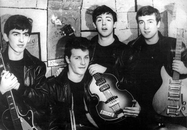Liverpool, UK - THE BEATLES in the original cast, GEORGE HARRISON, PETE BEST, PAUL MCCARTNEY, JOHN LENNON pictured during a concert in Cavern Club, Liverpool. One of the most commercially successful and critically acclaimed bands in the history of popular music, the Beatles led the mid-1960s musical British Invasion into the United States. Landing on these shores on February 7, 1964, they literally stood the world of pop culture on its head, setting the musical agenda for the remainder of the decade. Liverpool UK - ZUMAk09