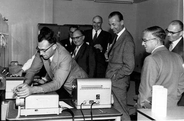 Sep 06, 1960; Winfrith, UK; Dr. SIEGFRIED BALKE, Federal German Minister for Nuclear Energy and Water Resources, yesterday (Sept. 5th), visited the Atomic Energy Establishment, Winfrith, as the guest of the Chairman of the United Kingdom Atomic Energy Authority, Sir ROGERS MAKINS and the Director of the A.E.E. Winfrith, Mr. D.W. FRY. The picture shows Dr. Balke (with glasses), watches Dr. G.N. LANCE, head of the Computer Branch of U.K.A.E.A. during his visit. Behind Dr. Balke (facing camera) is Sir Makins, on whose right is HERR MARTIUS. On left is Mr. Fry. Winfrith UK  - ZUMAk09