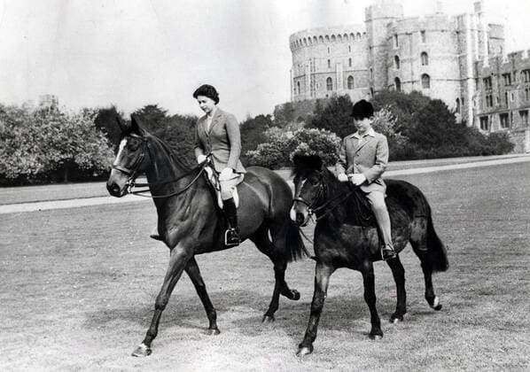 May 18, 1961 - London, England, UK - The elder daughter of King George VI and Queen Elizabeth, ELIZABETH WINDSOR (named Elizabeth II) became Queen at the age of 25, and has reigned through more than five decades of enormous social change and development. For more than 50 years, during a period of great social change, The Queen has carried out her political duties as Head of State, the ceremonial responsibilities of the Sovereign and an unprecedented programme of visits in the United Kingdom, Commonwealth and overseas. PICTURED: PRINCESS ELIZABETH with PRINCE CHARLES taking a horse ride. London UK  - ZUMAk09