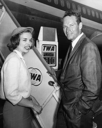 Nov 03, 1961; Rome, Italy; Actor CHARLTON HESTON known for his religious roles in Ben-Hur and The Ten Commandments , pictured with TWA hostess, NANCY FATENAUDE as he boards the plane to Berlin from Rome. Rome Italy  - ZUMAk09
