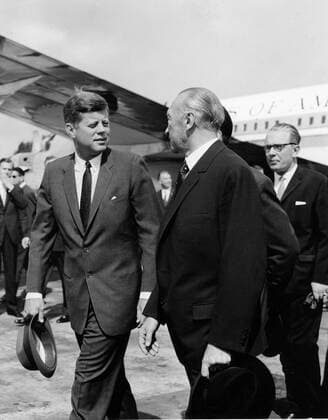Jun 23, 1963; Bonn, Germany; Visit of President JOHN F. KENNEDY to the Federal Republic of Germany, where he was welcoming by Dr. ADENAUER at the Wahn airport. In the background is federal Minister of Defence KAI-UWE VON HASSEL. Bonn Germany  - ZUMAk09